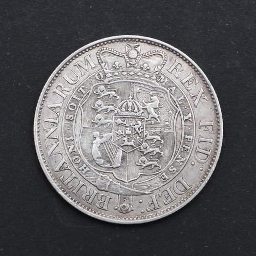 765 - A GEORGE III HALFCROWN, 1819. A George III Halfcrown, small laureate head r. dated 1819, reverse wit... 