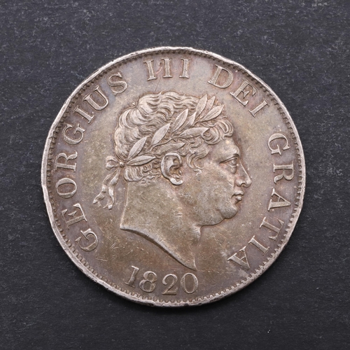 766 - A GEORGE III HALFCROWN, 1820. George III Halfcrown, small laureate bust r. with date 1820 below, rev... 