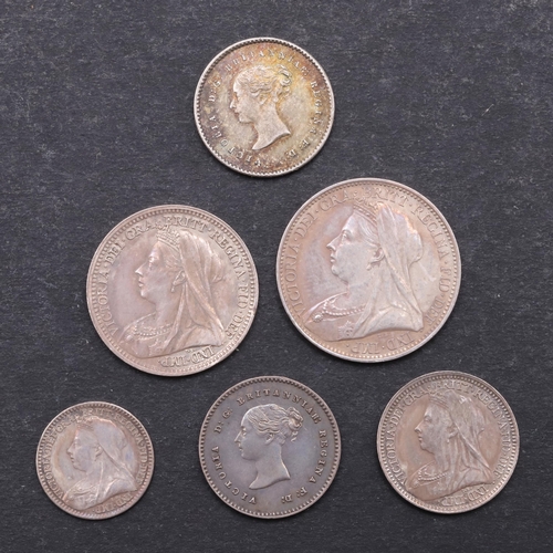 832 - QUEEN VICTORIA MAUNDY COINS FOR 1899 AND OTHERS. A set of Maundy coins, old veiled bust l. reverse w... 