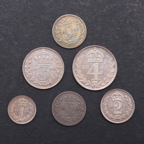 832 - QUEEN VICTORIA MAUNDY COINS FOR 1899 AND OTHERS. A set of Maundy coins, old veiled bust l. reverse w... 