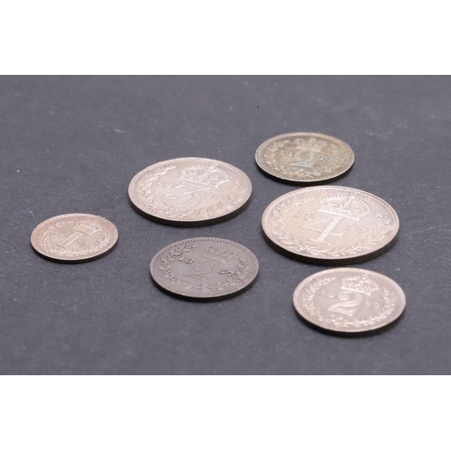 832 - QUEEN VICTORIA MAUNDY COINS FOR 1899 AND OTHERS. A set of Maundy coins, old veiled bust l. reverse w... 