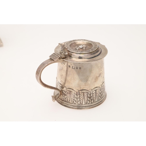 104 - THE WORSHIPFUL COMPANY OF MERCHANT TAYLORS':-. a George V small silver tankard, tapering circular fo... 