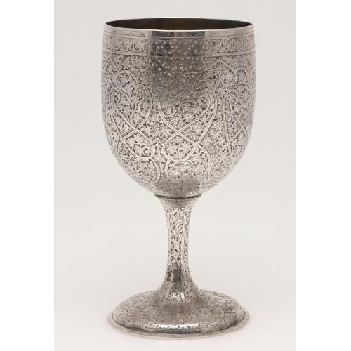 105 - A LATE 19TH/ EARLY 20TH CENTURY INDIAN SILVER GOBLET. of rounded circular form, the whole abundantly... 