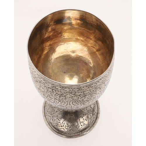 105 - A LATE 19TH/ EARLY 20TH CENTURY INDIAN SILVER GOBLET. of rounded circular form, the whole abundantly... 