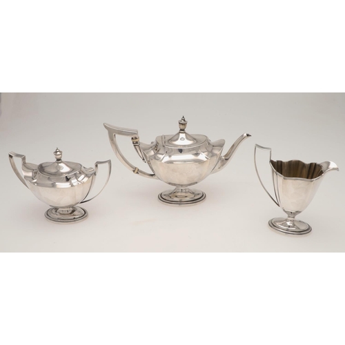 112 - A 20TH CENTURY THREE-PIECE NORTH AMERICAN SILVER TEA SET. of shaped oval form, with reeded handles a... 