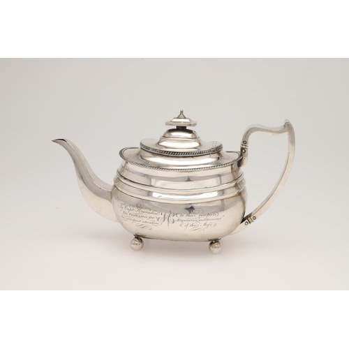 113 - A GEORGE III SILVER TEA POT. rounded oblong form, with gadrooned borders, a cushion finial and on ba... 