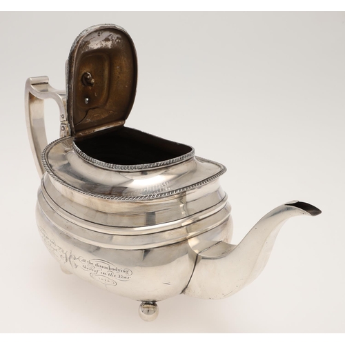 113 - A GEORGE III SILVER TEA POT. rounded oblong form, with gadrooned borders, a cushion finial and on ba... 