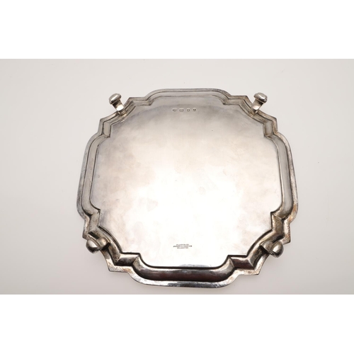 125 - A 20TH CENTURY SILVER SALVER. shaped square outline, with incurved corners and a moulded border, rai... 