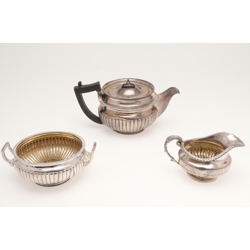 134 - A GEORGE III SILVER TEA POT & MATCHING SUGAR BOWL. of squat circular form, with angular handles and ... 