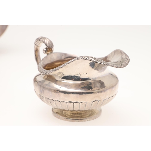 134 - A GEORGE III SILVER TEA POT & MATCHING SUGAR BOWL. of squat circular form, with angular handles and ... 