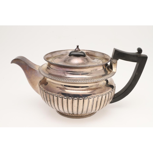 134 - A GEORGE III SILVER TEA POT & MATCHING SUGAR BOWL. of squat circular form, with angular handles and ... 