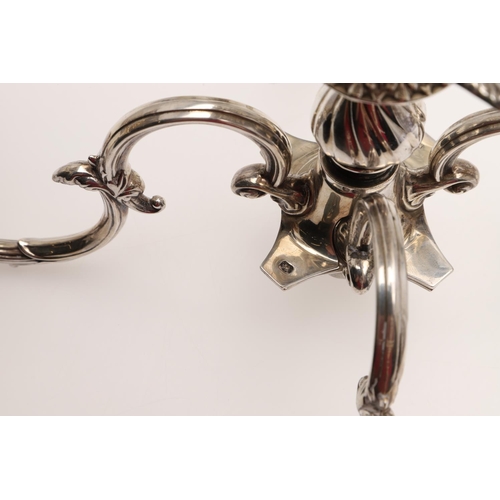 138 - A PAIR OF LATE VICTORIAN SILVER FIVE-LIGHT CANDELABRA BRANCHES. the Corinthian capitals with four sc... 