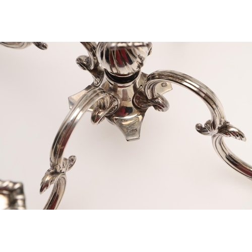 138 - A PAIR OF LATE VICTORIAN SILVER FIVE-LIGHT CANDELABRA BRANCHES. the Corinthian capitals with four sc... 