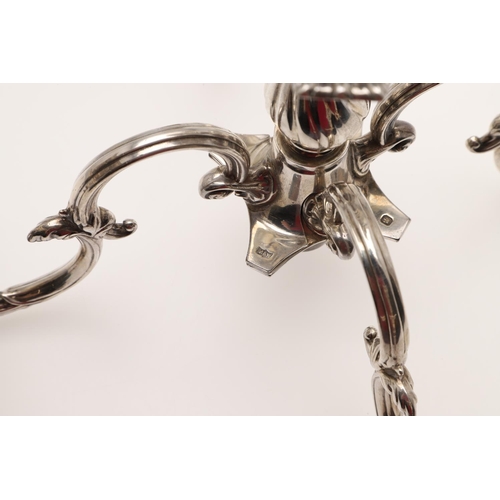 138 - A PAIR OF LATE VICTORIAN SILVER FIVE-LIGHT CANDELABRA BRANCHES. the Corinthian capitals with four sc... 