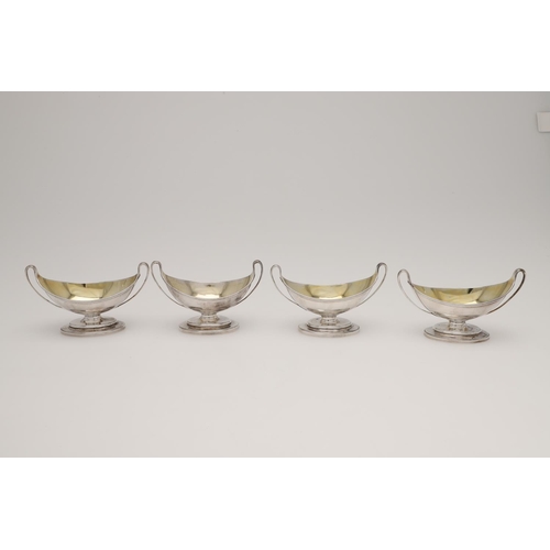 140 - A SET OF FOUR GEORGE III BOAT-SHAPED SILVER SALTS. with twin loop handles, reeded borders, and on a ... 