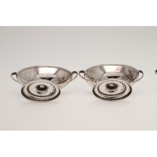 140 - A SET OF FOUR GEORGE III BOAT-SHAPED SILVER SALTS. with twin loop handles, reeded borders, and on a ... 