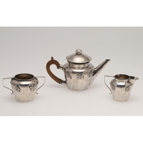 143 - AN ARTS & CRAFTS THREE PIECE SILVER TEA SET, BY AMY SANDHEIM. tapering circular form, with corded bo... 