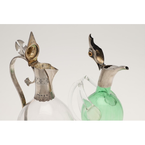 151 - A LATE VICTORIAN SILVER MOUNTED GREEN GLASS NOVELTY LIQUEUR FLASK. modelled with an eagles head, col... 