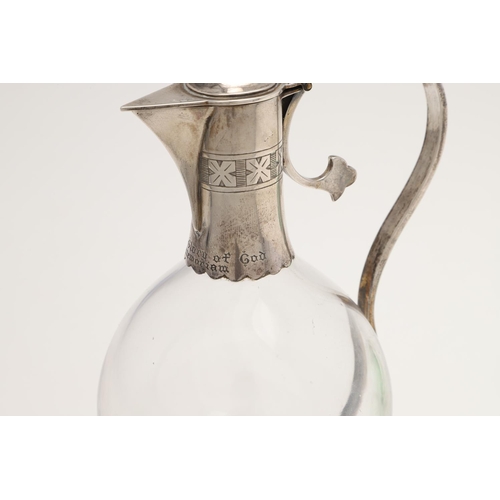 151 - A LATE VICTORIAN SILVER MOUNTED GREEN GLASS NOVELTY LIQUEUR FLASK. modelled with an eagles head, col... 