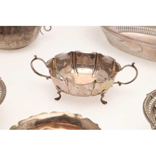 155 - AN EDWARDIAN SILVER BREAD BASKET. of navette outline, with a  punch bead border, pierced sides and e... 