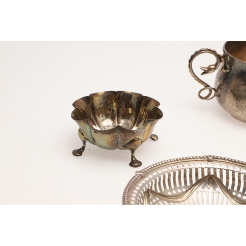 155 - AN EDWARDIAN SILVER BREAD BASKET. of navette outline, with a  punch bead border, pierced sides and e... 