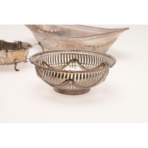 155 - AN EDWARDIAN SILVER BREAD BASKET. of navette outline, with a  punch bead border, pierced sides and e... 