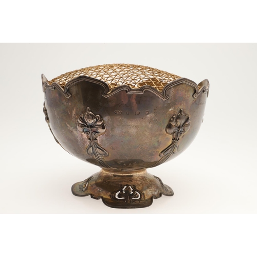 156 - AN EDWARDIAN SILVER ART-NOUVEAU ROSE BOWL. of shaped circular outline, with a moulded border, applie... 