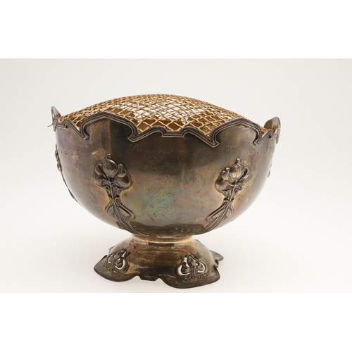 156 - AN EDWARDIAN SILVER ART-NOUVEAU ROSE BOWL. of shaped circular outline, with a moulded border, applie... 