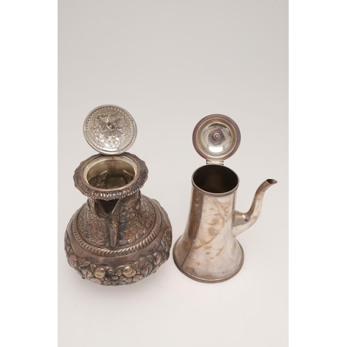 158 - AN EDWARDIAN SILVER HOT WATER JUG. circular form, with a scroll handle and the whole profusely embos... 