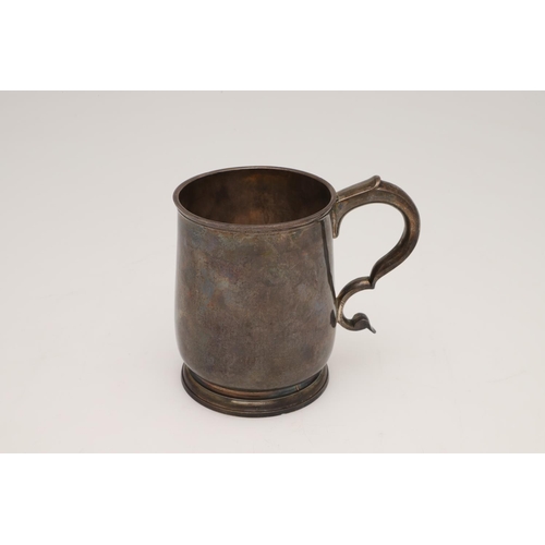 162 - A GEORGE II SILVER PINT MUG. of baluster form, with an 'S'-scroll handle and raised on a circular fo... 