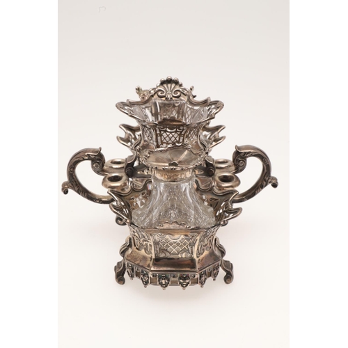 171 - AN 18TH CENTURY TWO-BOTTLE SILVER STAND. with three shaped circular sections moulded scroll & shell ... 