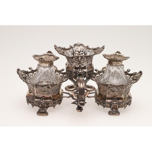 171 - AN 18TH CENTURY TWO-BOTTLE SILVER STAND. with three shaped circular sections moulded scroll & shell ... 