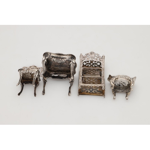 192 - SILVER MINIATURES OR TOYS. 5 chairs, 2 tables, a matched three-piece tea set, a bookcase, a candlest... 