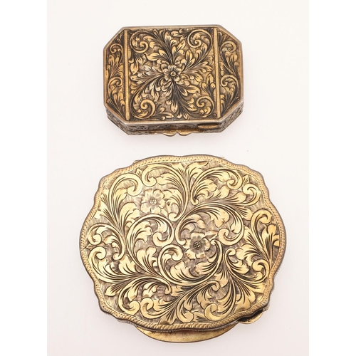 221 - TWO LATE 19TH/ EARLY 20TH CENTURY ITALIAN SILVERGILT & ENAMEL COMPACTS. one shaped oval and the othe... 