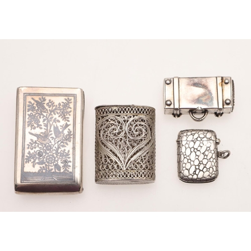 235 - FOUR SILVER VESTA CASES. to include a continental niello example with a slide-out mechanism and a se... 