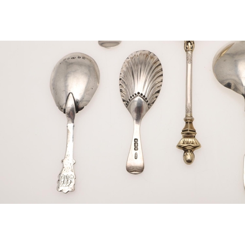 37 - SEVEN SILVER CADDY SPOONS. including a filigree example, unmarked, a George III caddy spoon, no make... 