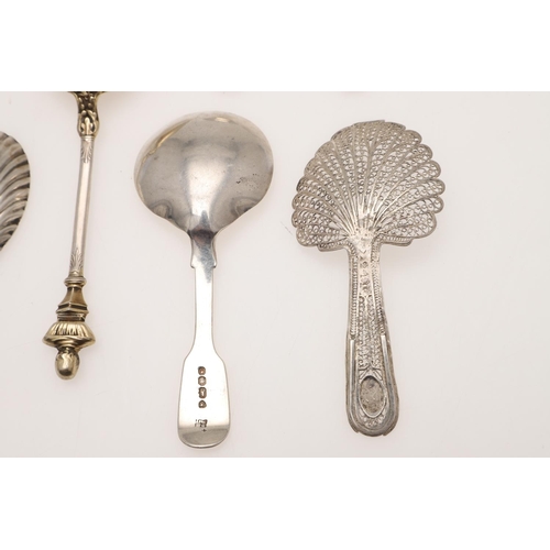 37 - SEVEN SILVER CADDY SPOONS. including a filigree example, unmarked, a George III caddy spoon, no make... 