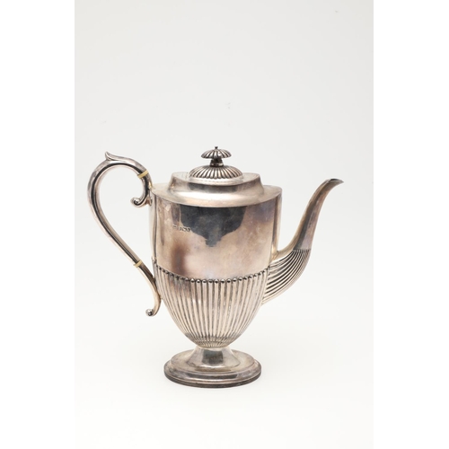 47 - A LATE VICTORIAN FOUR-PIECE SILVER TEA & COFFEE SERVICE. of oval form, with scroll handles and the b... 