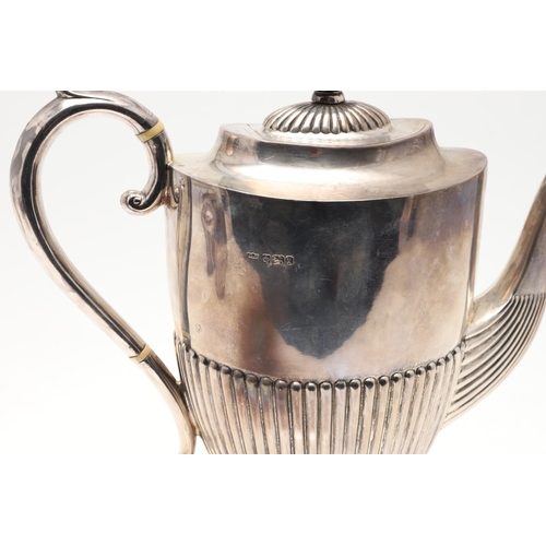 47 - A LATE VICTORIAN FOUR-PIECE SILVER TEA & COFFEE SERVICE. of oval form, with scroll handles and the b... 