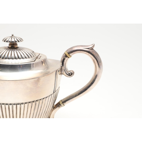 47 - A LATE VICTORIAN FOUR-PIECE SILVER TEA & COFFEE SERVICE. of oval form, with scroll handles and the b... 