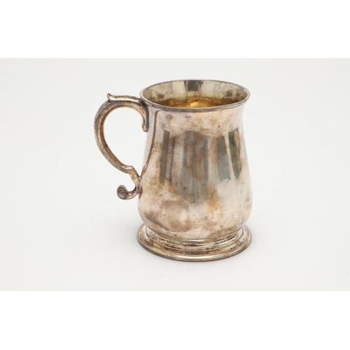 48 - A GEORGE II SILVER BALUSTER MUG. with an 'S'-scroll handle and a spreading circular foot, gilt inter... 