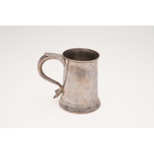 49 - A GEORGE III SILVER MUG. tapering circular form, with a slightly everting rim, an 'S'-scroll handle,... 