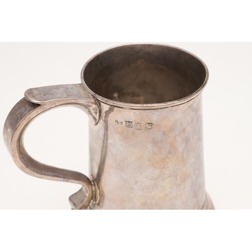 49 - A GEORGE III SILVER MUG. tapering circular form, with a slightly everting rim, an 'S'-scroll handle,... 