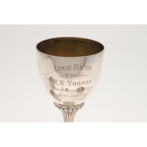 73 - A LATE 19TH/ EARLY 20TH CENTURY GERMAN SILVER PRESENTATION CUP. circular form, with a fluted stem an... 