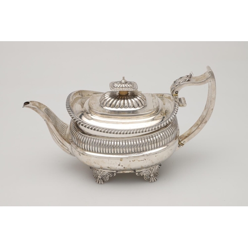 74 - A GEORGE IV THREE-PIECE SILVER TEA SET. with rounded oblong bodies, gadrooned borders,  fluted decor... 