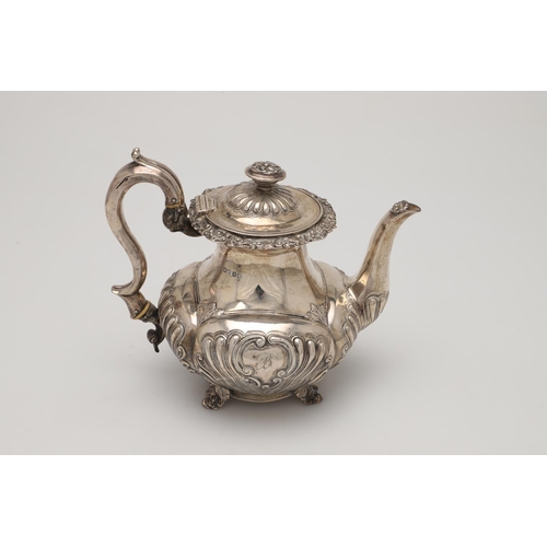 75 - A GEORGE IV SILVER COFFEE POT. with an embossed lobed body, a waisted neck, decorated with an applie... 