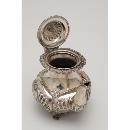 75 - A GEORGE IV SILVER COFFEE POT. with an embossed lobed body, a waisted neck, decorated with an applie... 