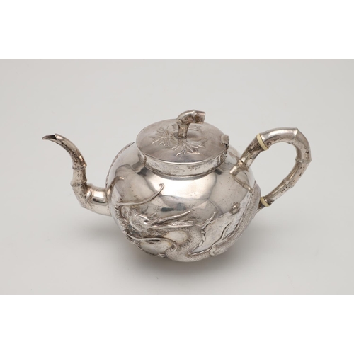 84 - A LATE 19TH/ EARLY 20TH CENTURY THREE-PIECE CHINESE SILVER TEA/ COFFEE SET. circular form, with natu... 