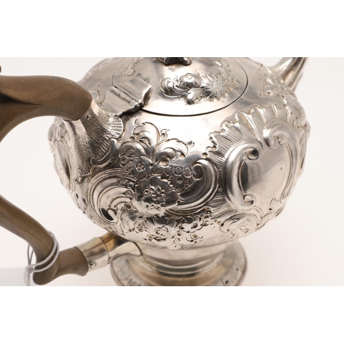 86 - A GEORGE III SILVER TEA POT. inverted baluster form, with a figural finial, scroll handle and later ... 