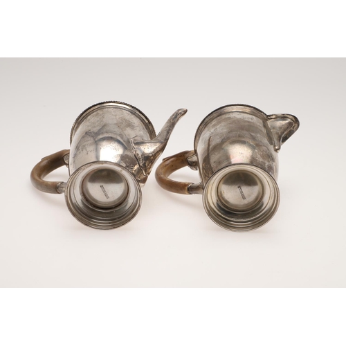 92 - A VERY NEAR PAIR OF 20TH CENTURY SILVER CAFE AU LAIT POTS. circular form, with gadrooned borders, ap... 